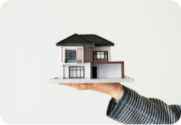 holding a commercial building over a hand